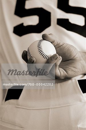Close-Up of Baseball Pitcher Holding Ball Behind Back