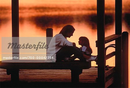 Mother and Daughter on Dock at Sunset