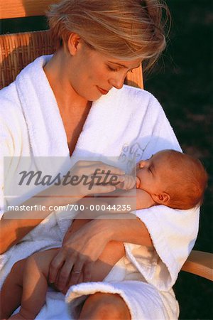 Mother Holding Baby Outdoors