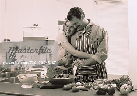 Couple Preparing Food in Kitchen