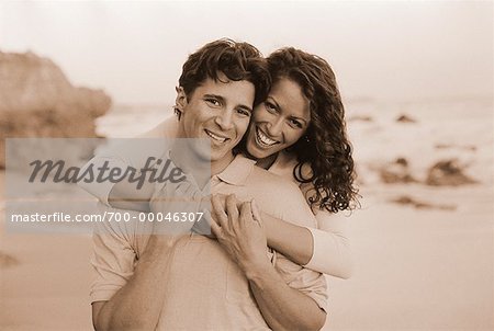 Portrait of Couple Embracing on Beach