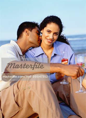 Couple with Drinks on Beach