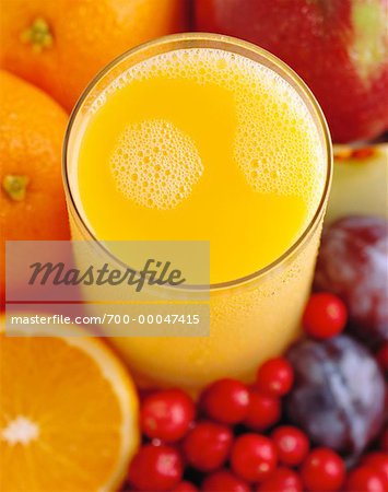 Close-Up of Fruit and Glass of Orange Juice