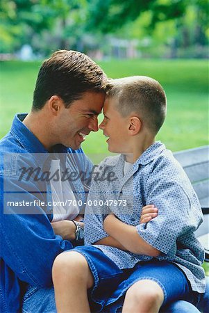 Father and Son Face to Face Outdoors