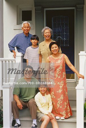 Portrait of Family Standing on Porch