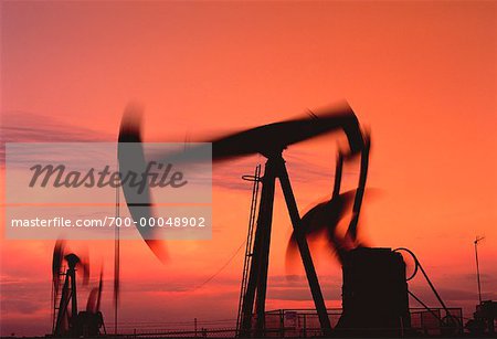 Oil Pump Jacks in Motion at Sunset, Alberta, Canada