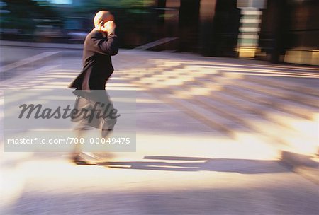 Businessman Using Cell Phone Outdoors