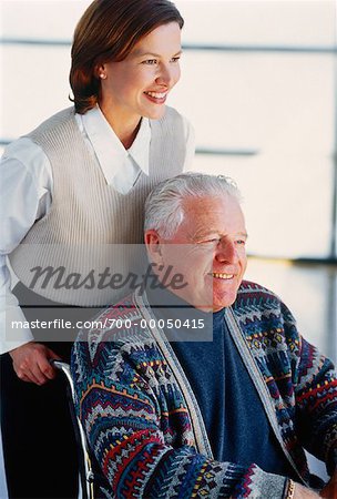 Woman with Mature Man in Wheelchair