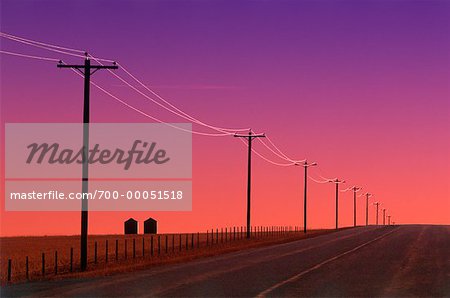 Country Road and Power Lines at Sunrise, near Pincher Creek, Alberta, Canada