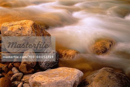 Close-Up of Water Rushing over Rocks, Tetsa River British Columbia, Canada