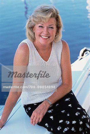 Portrait of Mature Woman Sitting On Boat, Smiling