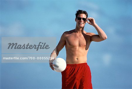 Portrait of Man Holding Volleyball on Beach - Stock Photo - Masterfile -  Rights-Managed, Artist: David P. Hall, Code: 700-00055256