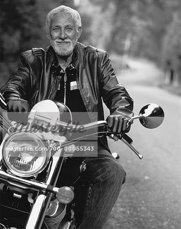 Old man riding online motorcycle