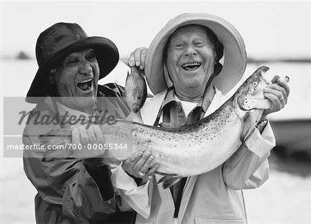 Portrait of Two Mature Men Holding Fish Near Lake - Stock Photo -  Masterfile - Rights-Managed, Artist: Ron Fehling, Code: 700-00055344