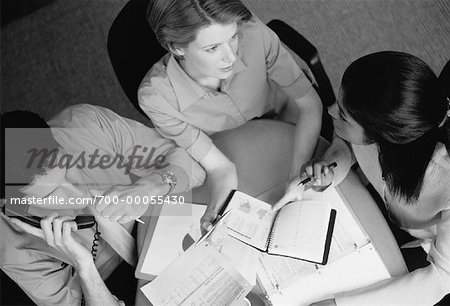 Overhead View of Three Business People in Meeting