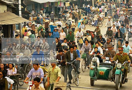 People Crossing Street In The Busy Streets Of Hanoi, Vietnam Stock