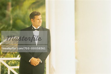 Man in Formal Wear, Leaning On Pillar