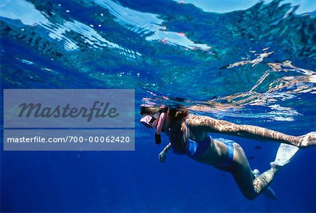 Underwater View of Woman Snorkelling near Molokini Island Maui, Hawaii, USA