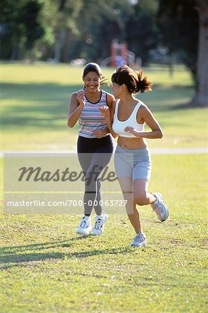 Two Women Running in Field