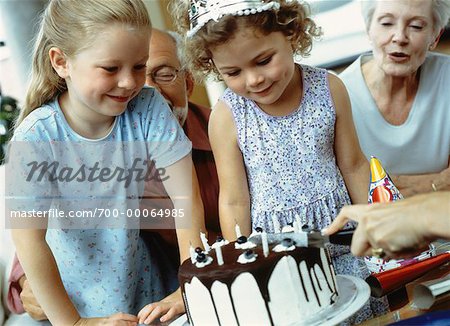 Cutting Cake at Children's Birthday Party