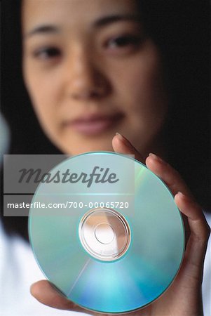 Portrait of Woman Holding Compact Disc