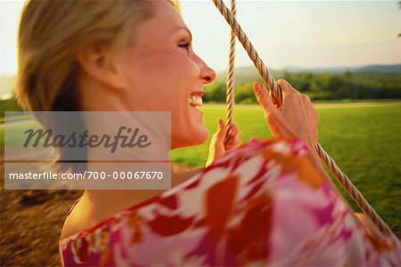 Woman on Swing, Laughing Belgrade Lakes, Maine, USA