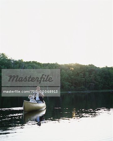 Man Canoeing with Dog Bala, Ontario, Canada