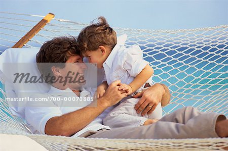 Father and Son Face to Face in Hammock