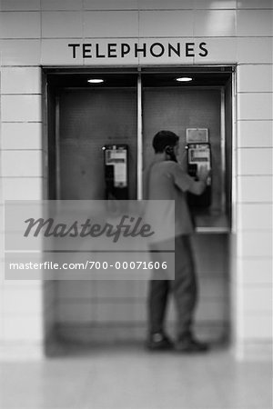 Back View Of Man Using Payphone Stock Photo Masterfile Rights Managed Artist Michael Mahovlich Code 700
