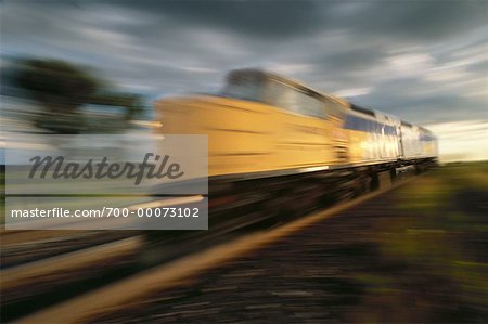 Blurred View of Speeding Train At Sunset