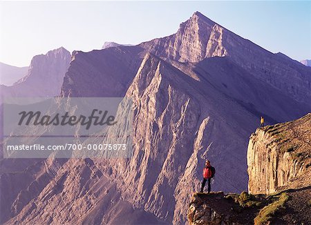 Mountain Climbers Overlooking Canadian Rockies at Sunrise Canmore, Alberta, Canada