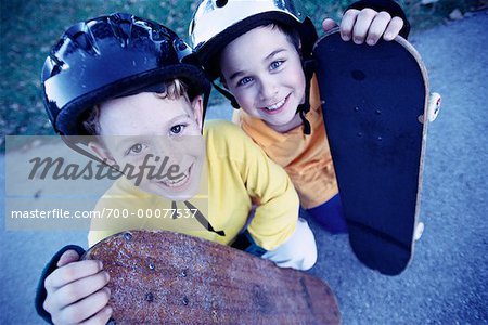 Portrait of Two Boys with Skateboards Outdoors