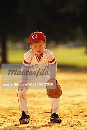 Portrait of Little League Baseball Player in Field - Stock Photo