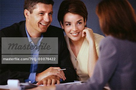 Couple in Meeting with Businesswoman