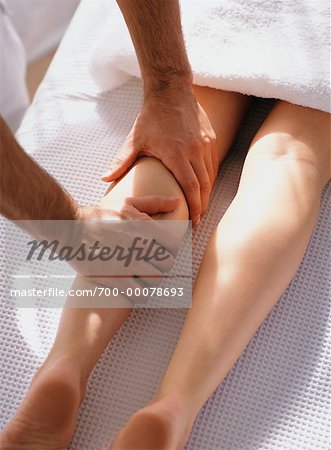 Woman Having Legs Massaged