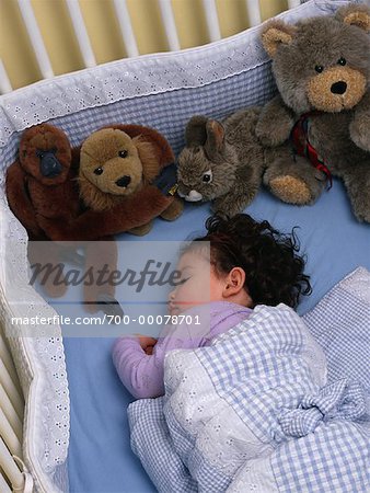 stuffed animals in crib