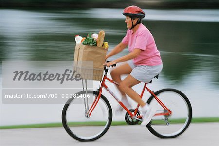 Lady riding bike clearance with baby in bag