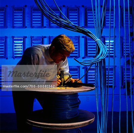 Man Installing Wiring for Computer Network