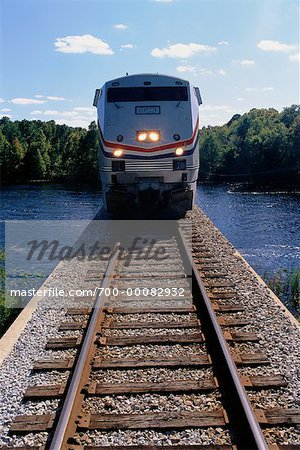 Front View of Passenger Train Crossing Black Creek Near Jacksonville, Florida, USA