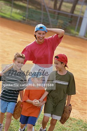 Mother and Children with Baseball Equipment Outdoors