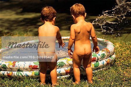 Back View of Two Nude Children Standing by Inflatable Swimming Pool - Stock  Photo - Masterfile - Rights-Managed, Artist: Richard Smith, Code:  700-00085423