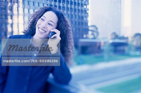 Businesswoman Using Cell Phone Smiling Outdoors