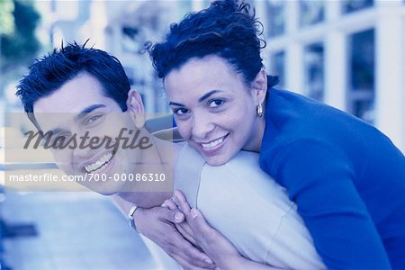 Portrait of Couple Embracing Outdoors