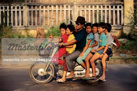 Man with Six Children on Motorcycle Phnom Penh, Cambodia