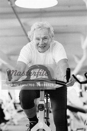 Mature Woman on Stationary Bike In Gym