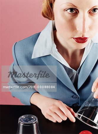 Businesswoman with Cups and Ball