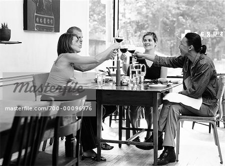 People Toasting in Restaurant