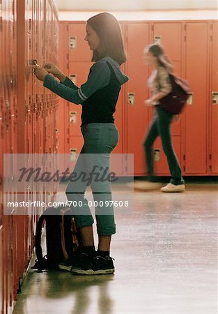 Student at Locker in School Hallway