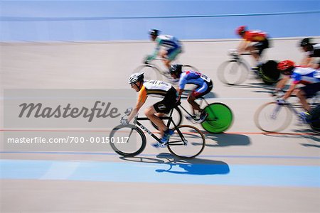 People Bicycle Racing on Track