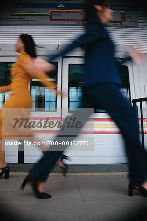 Blurred View of Women Walking By Subway